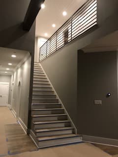 Contemporary iron rails along a stairway
