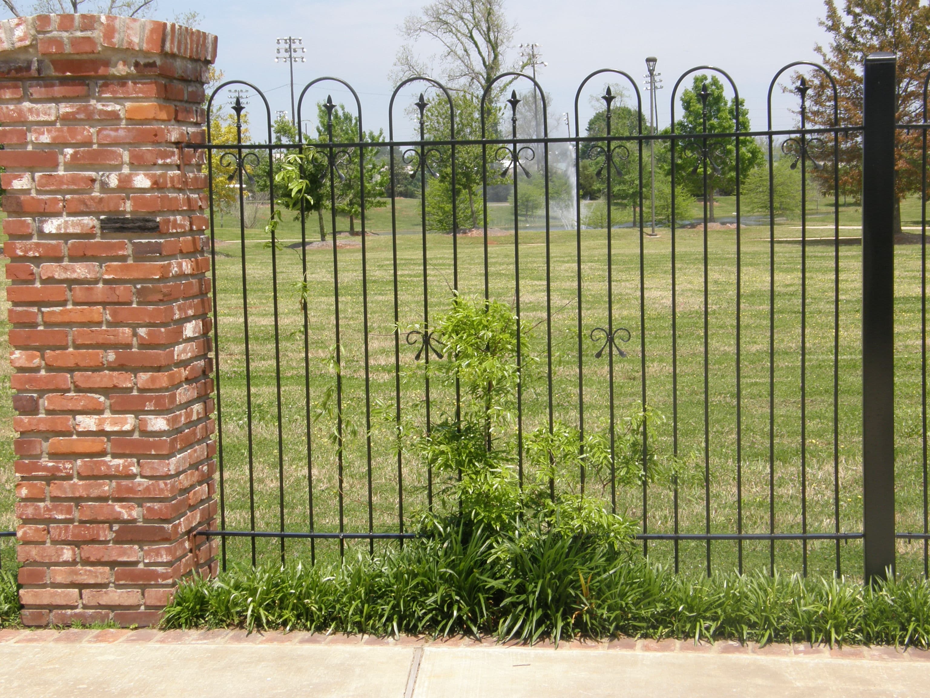Brick and iron fence — detail view