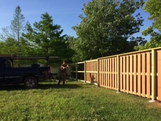 Cedar shadowbox fence install in progress